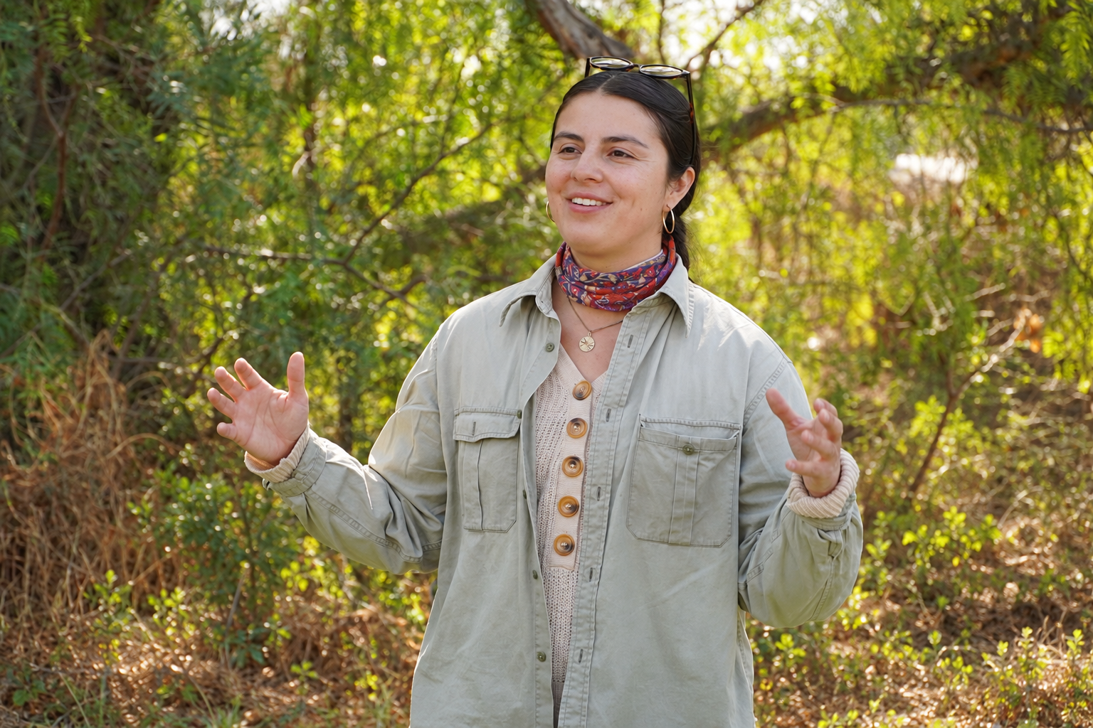 Georgina Silva outdoors, gesturing during a conversation.